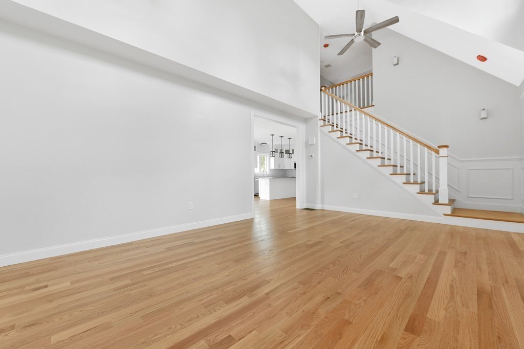 35 Roosevelt Road Dedham, MA 02026 - Photo 12 of 40 a view of a room with wooden floor and staircase