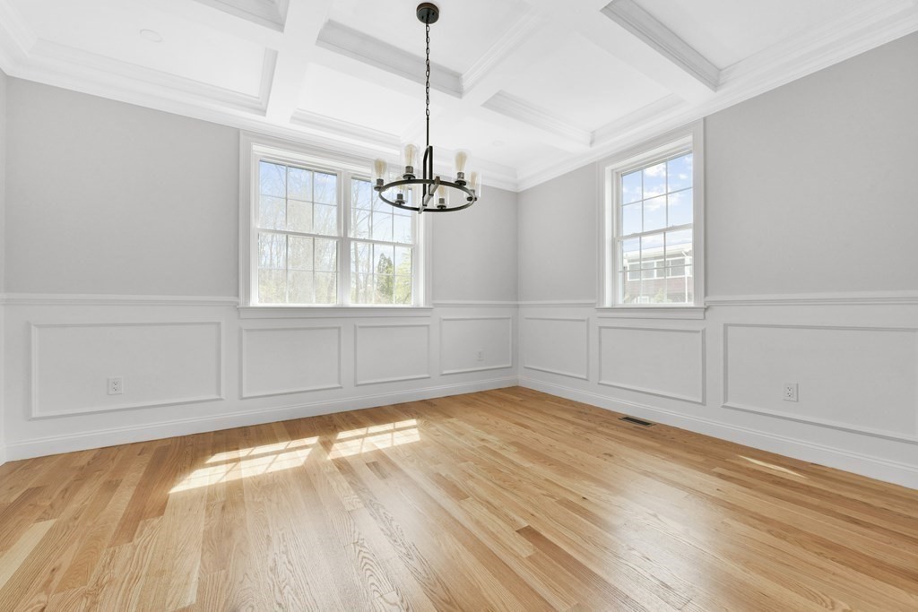 35 Roosevelt Road Dedham, MA 02026 - Photo 15 of 40 a view of an empty room with wooden floor and a window