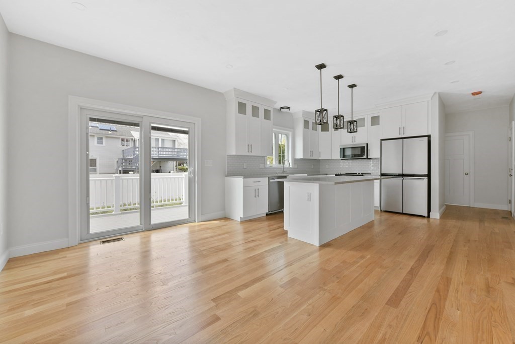 35 Roosevelt Road Dedham, MA 02026 - Photo 18 of 40 a view of a kitchen with wooden floor