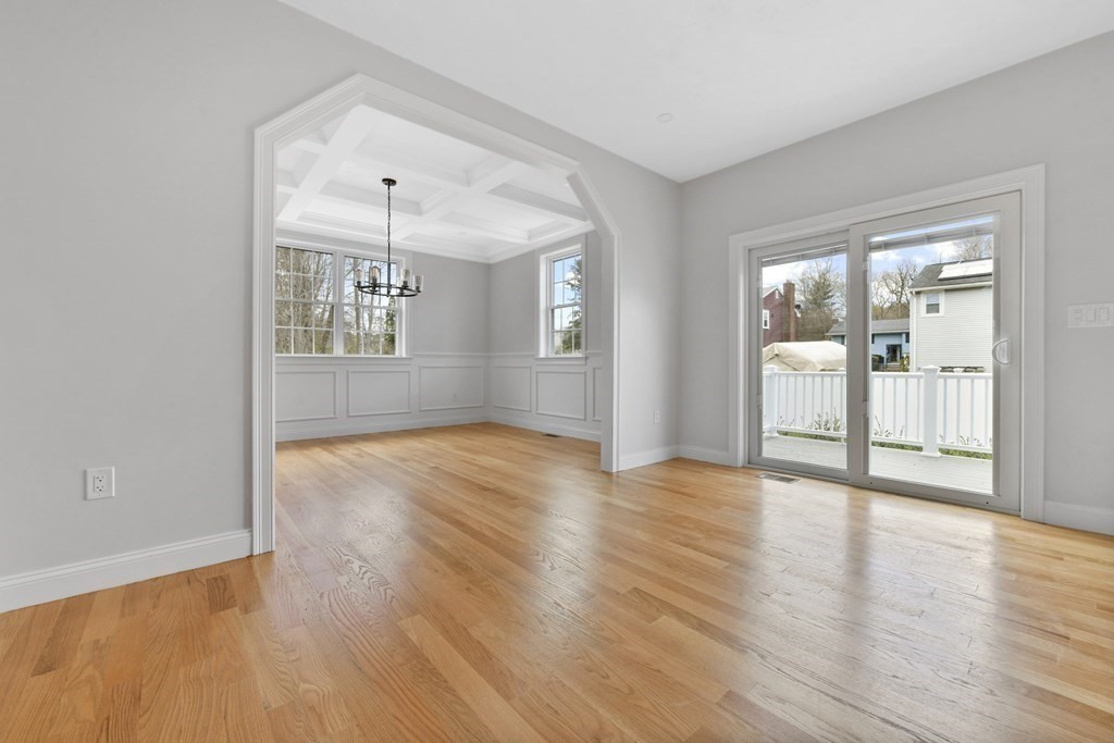 35 Roosevelt Road Dedham, MA 02026 - Photo 22 of 40 an empty room with wooden floor and windows