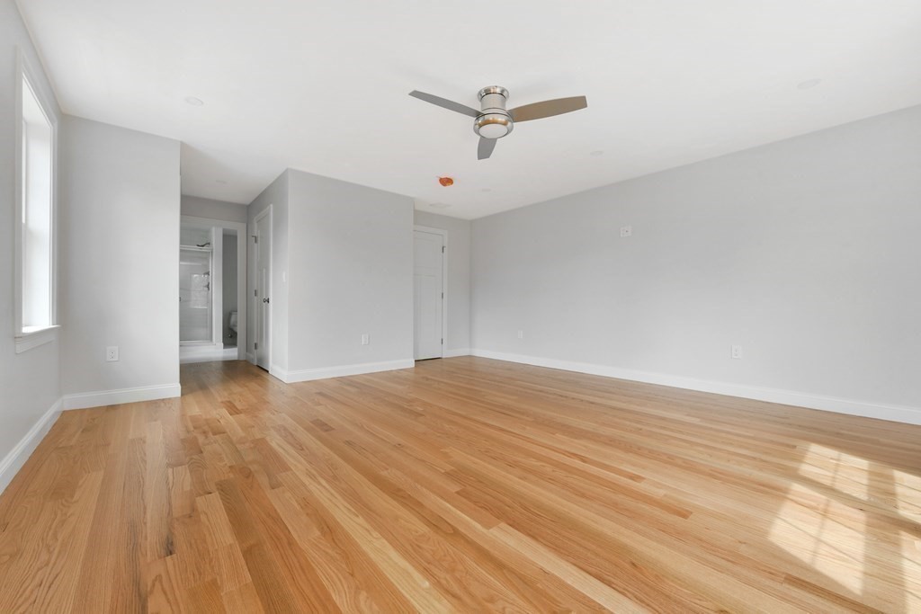 35 Roosevelt Road Dedham, MA 02026 - Photo 29 of 40 a view of empty room with wooden floor and fan