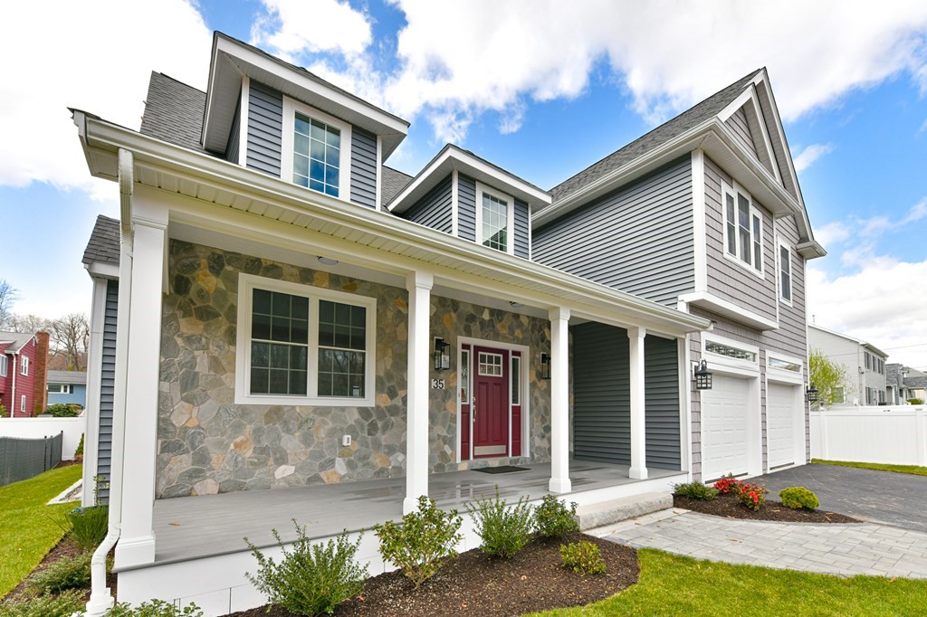 35 Roosevelt Road Dedham, MA 02026 - Photo 3 of 40 a front view of a house with a yard