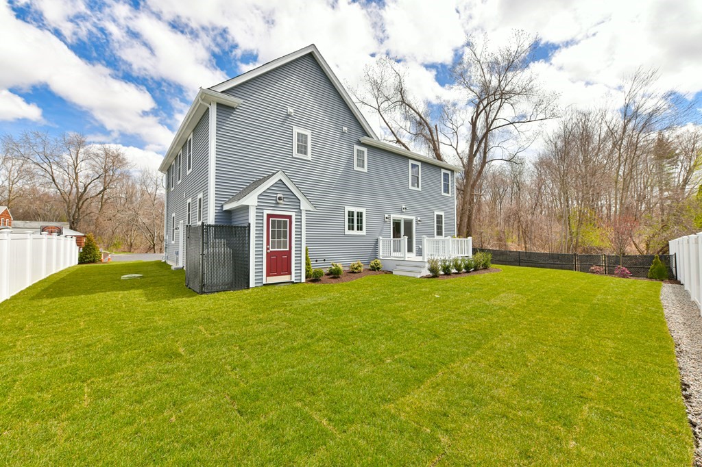 35 Roosevelt Road Dedham, MA 02026 - Photo 5 of 40 front view of a house with a yard