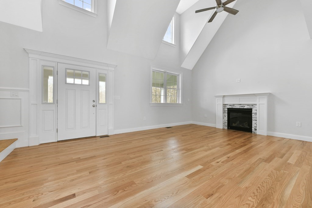35 Roosevelt Road Dedham, MA 02026 - Photo 9 of 40 a view of an empty room with a fireplace and a window