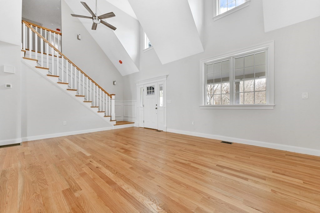 35 Roosevelt Road Dedham, MA 02026 - Photo 10 of 40 a view of an empty room with wooden floor and a window