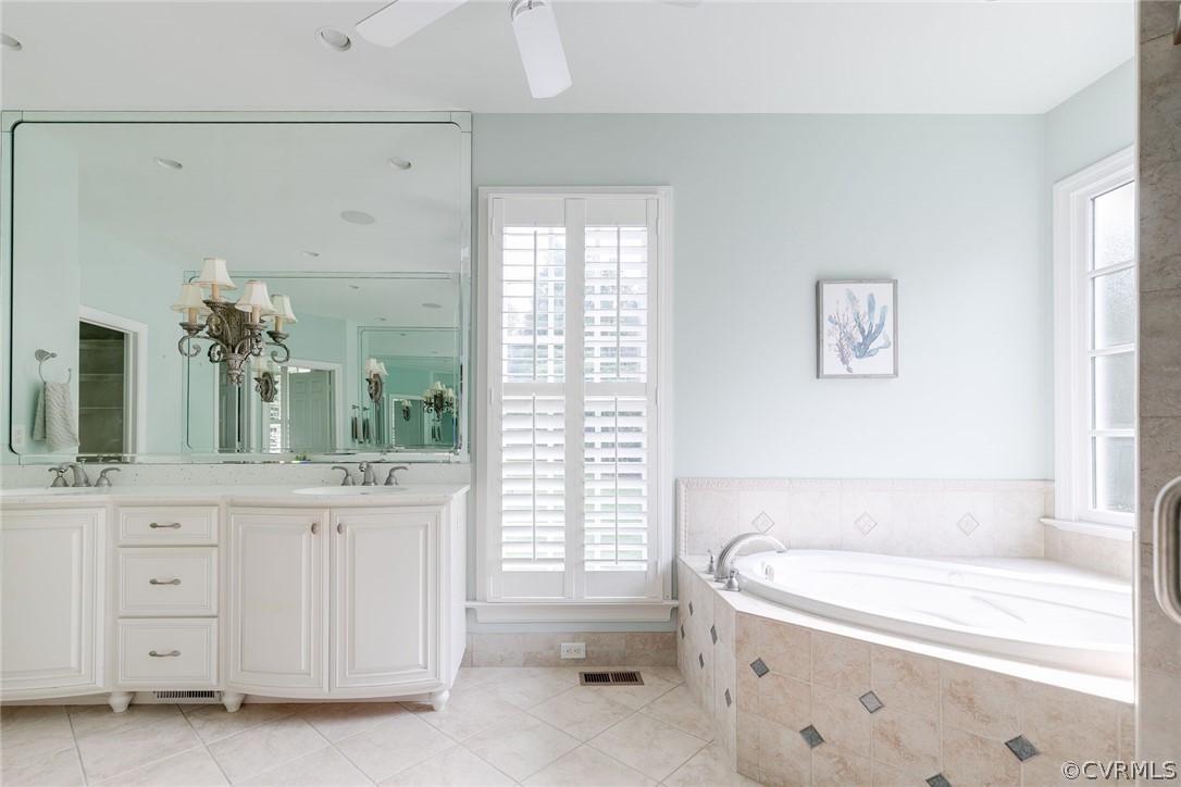 200 Kinloch Road Manakin-Sabot, VA 23103 - Photo 19 of 32 a bathroom with a bathtub a sink and a window