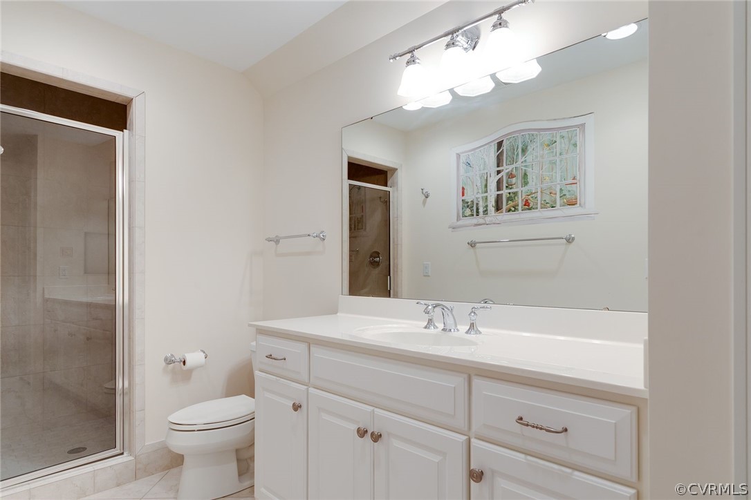 200 Kinloch Road Manakin-Sabot, VA 23103 - Photo 28 of 32 a bathroom with a sink a toilet and a mirror