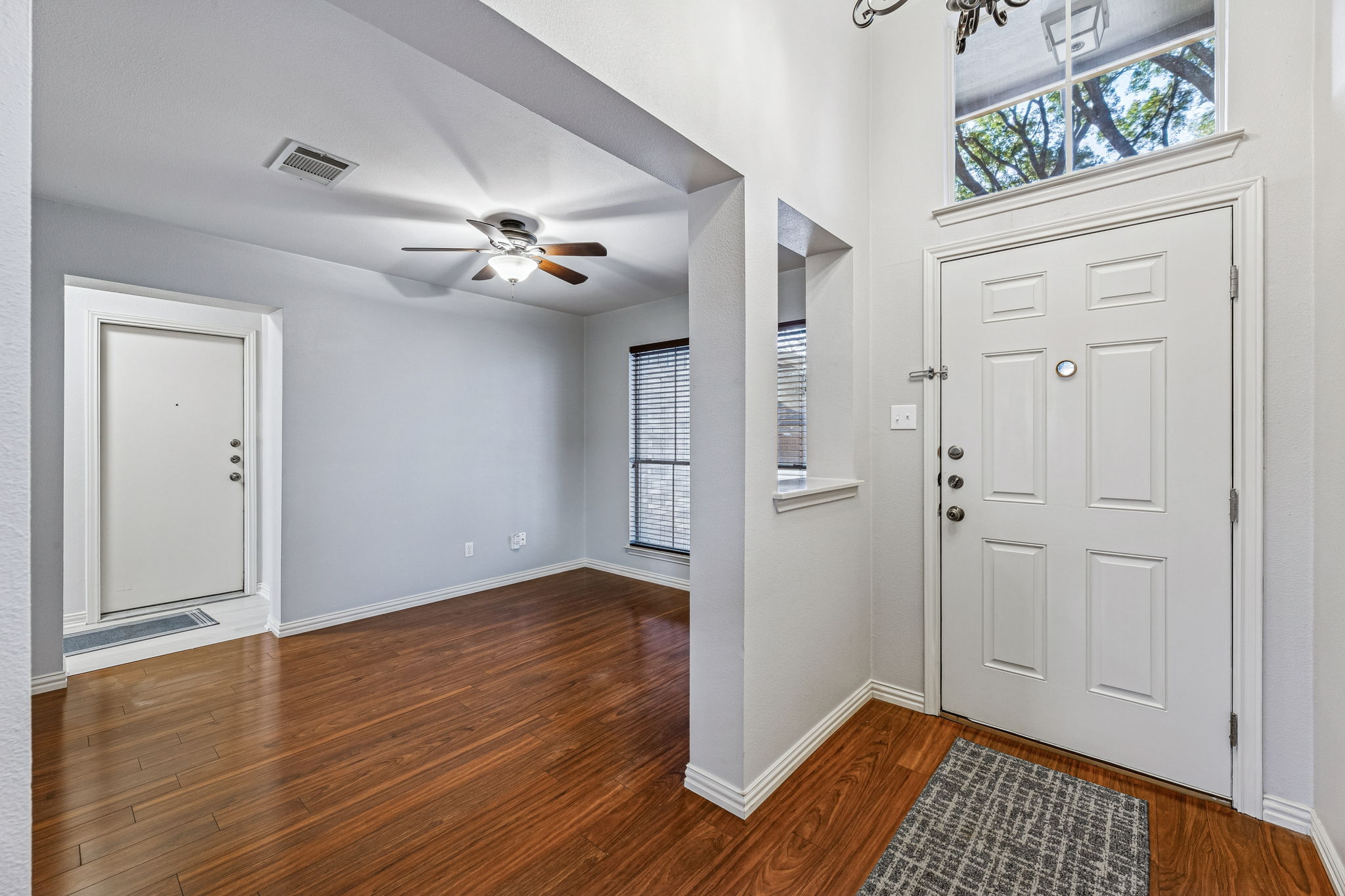1608 Melibee Trail Austin, TX 78748 - Photo 4 of 29 wooden floor in an empty room with a window