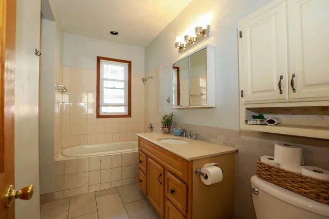 a bathroom with a sink a vanity and a mirror