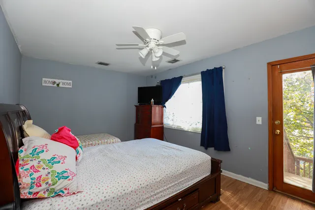 a bedroom with a bed and window