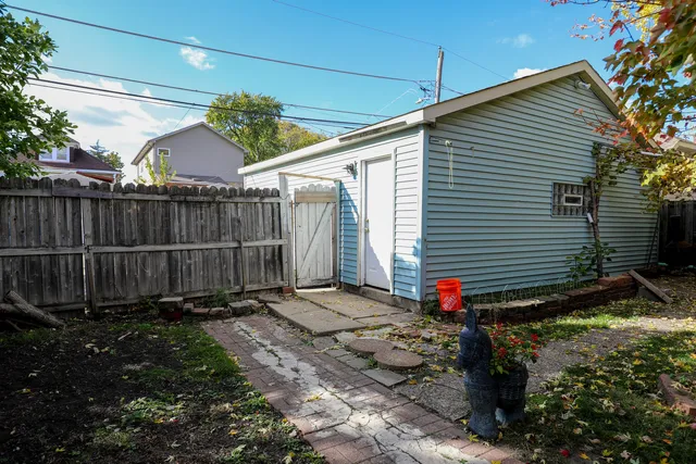 a view of a backyard with a small cabin