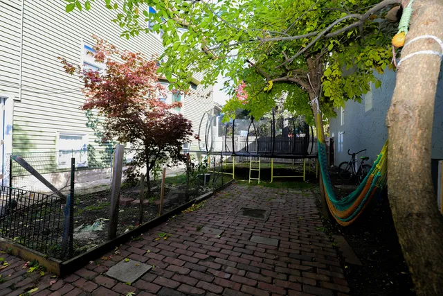 a backyard of a house with lots of green space