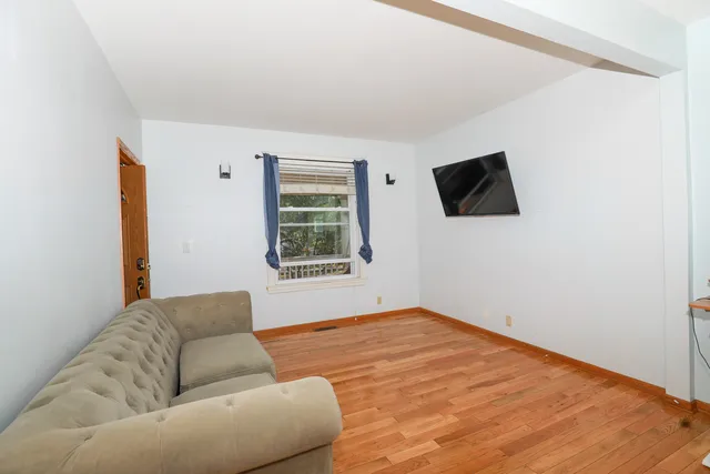 a living room with a couch and a flat screen tv