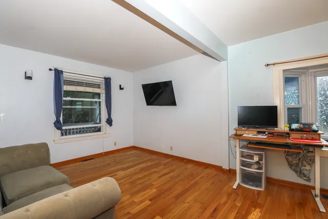 a workspace with furniture and wooden floor