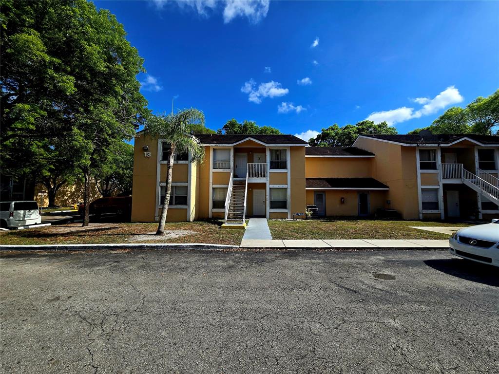 8100 Southwest 21st Court, Unit 8100 Miramar, FL 33025 - Photo 11 of 22 a front view of a house with a garden