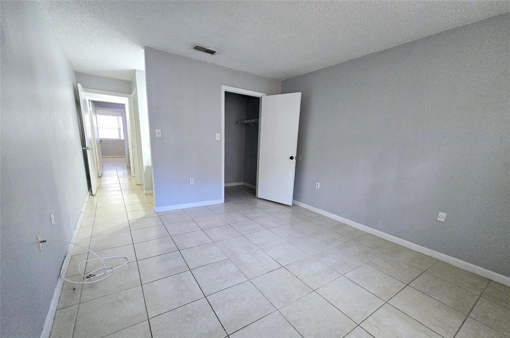 8100 Southwest 21st Court, Unit 8100 Miramar, FL 33025 - Photo 13 of 22 a view of an empty room and window