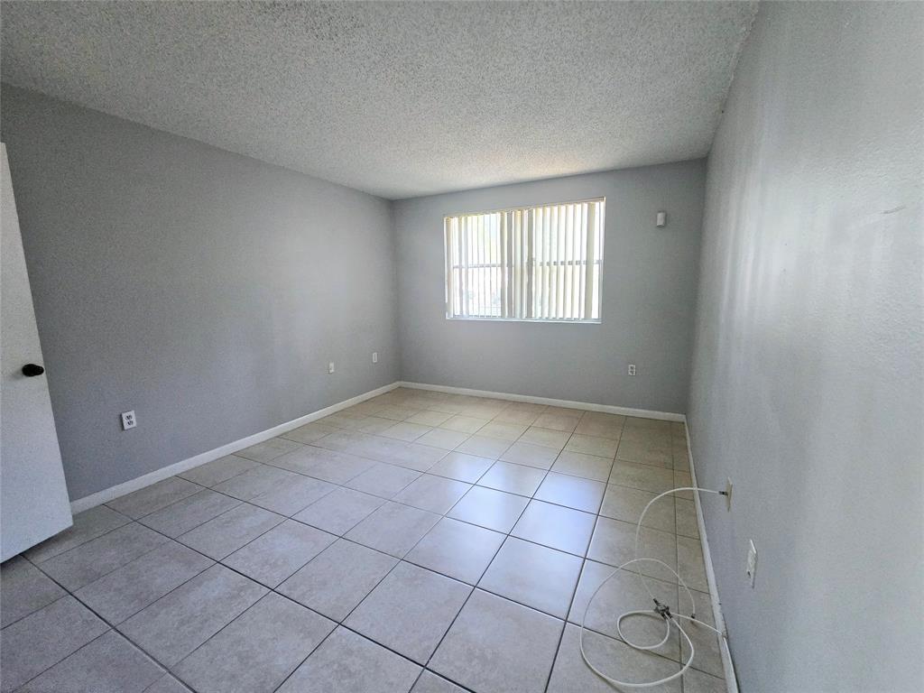 8100 Southwest 21st Court, Unit 8100 Miramar, FL 33025 - Photo 14 of 22 an empty room with windows