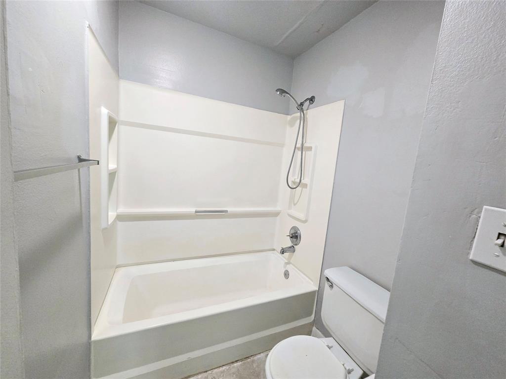 8100 Southwest 21st Court, Unit 8100 Miramar, FL 33025 - Photo 15 of 22 a bathroom with a toilet and a bathtub