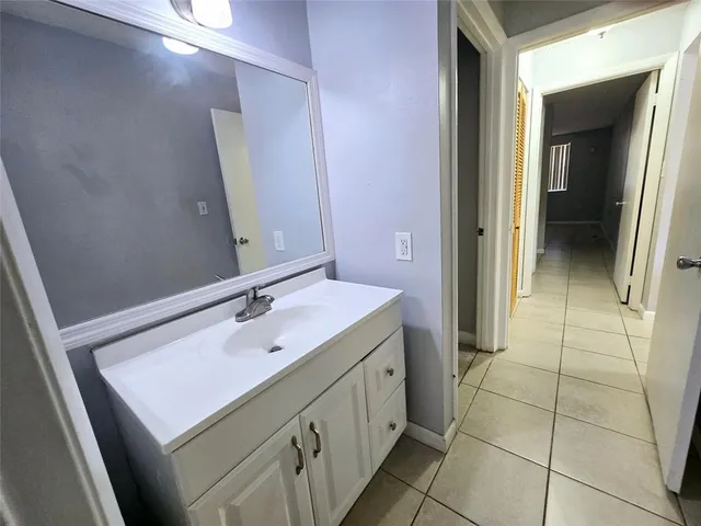 a view of an empty room with closet area