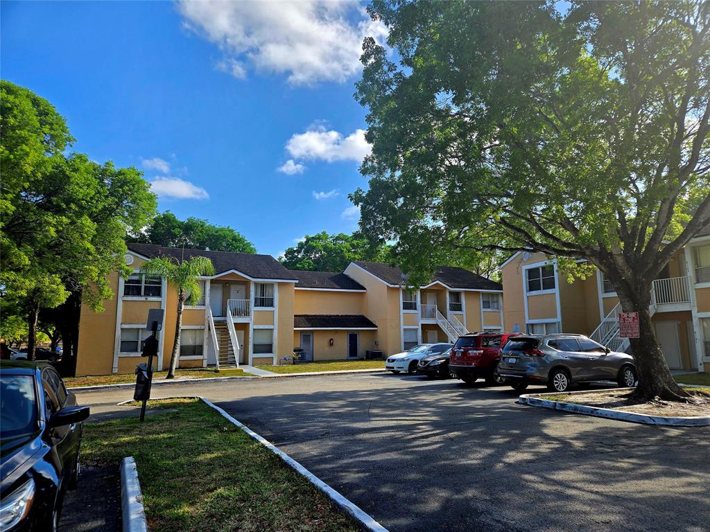 8100 Southwest 21st Court, Unit 8100 Miramar, FL 33025 - Photo 2 of 22 a view of a yard in front of house