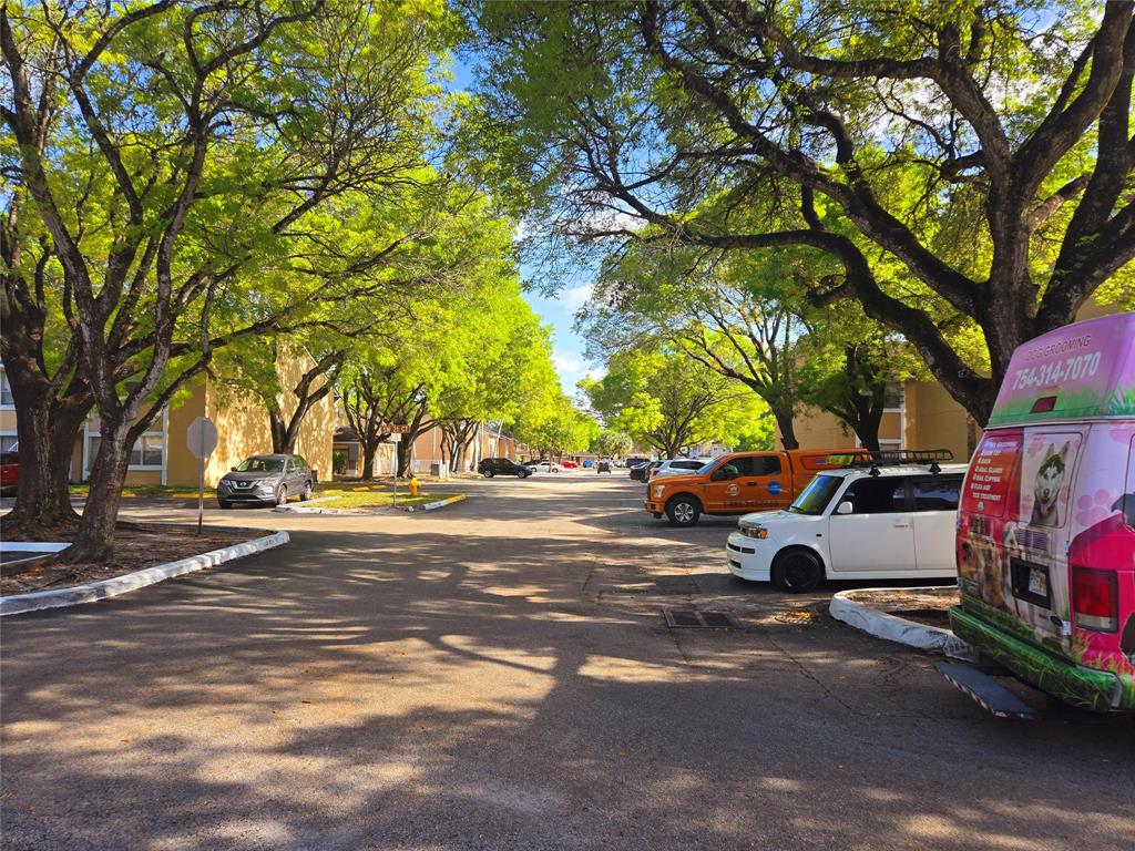 8100 Southwest 21st Court, Unit 8100 Miramar, FL 33025 - Photo 3 of 22 a view of street with parked cars