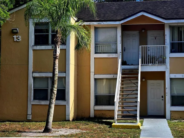 a front view of a house with parking area