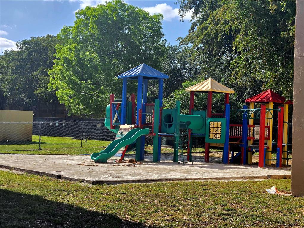 8100 Southwest 21st Court, Unit 8100 Miramar, FL 33025 - Photo 6 of 22 a view of a park with swings and slides