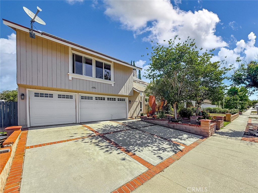 2235 Burnside Street Simi Valley, CA 93065 - Photo 4 of 71 a front view of a house with a yard