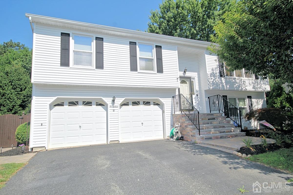 17 Higgins Road Old Bridge, NJ 08857 - Photo 1 of 30 a front view of a house with a yard and garage