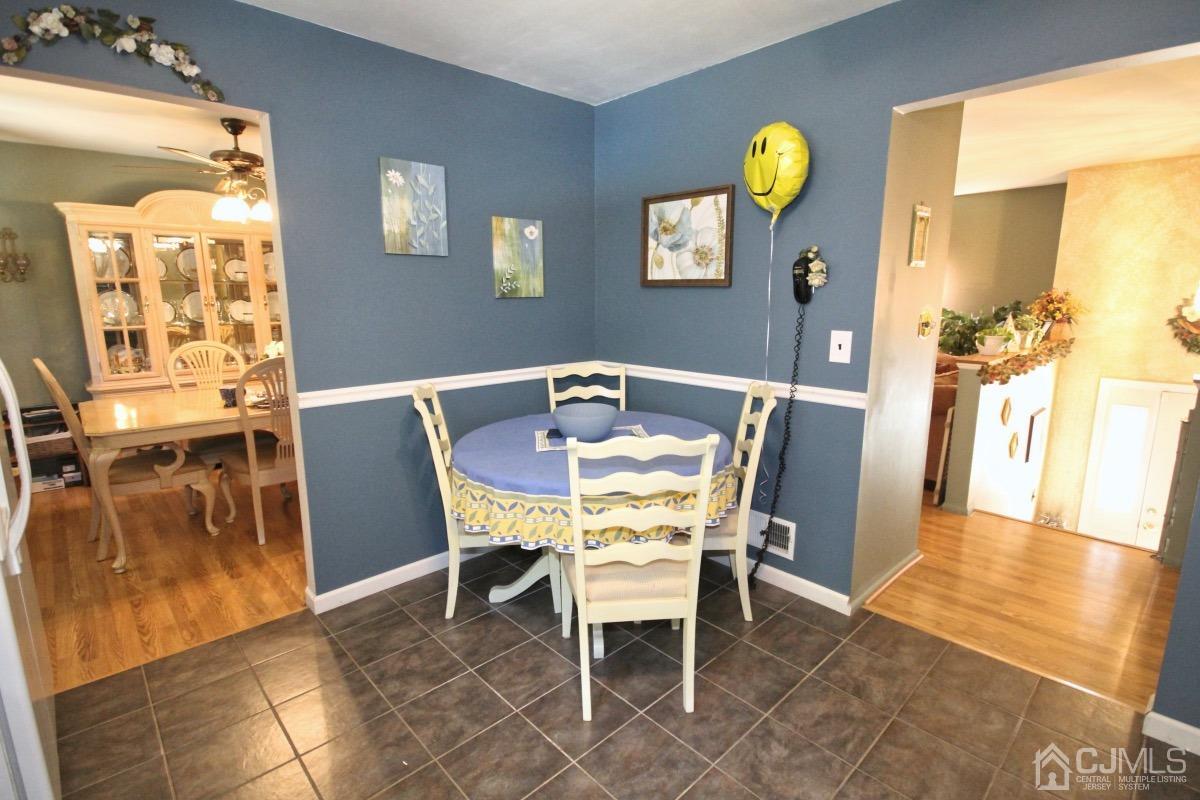 17 Higgins Road Old Bridge, NJ 08857 - Photo 12 of 30 a view of a dining room with furniture and wooden floor