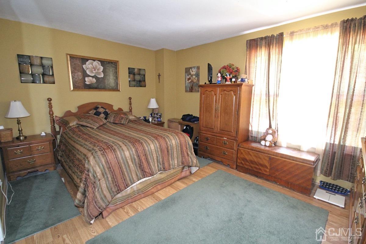 17 Higgins Road Old Bridge, NJ 08857 - Photo 15 of 30 a spacious bedroom with a bed and a window