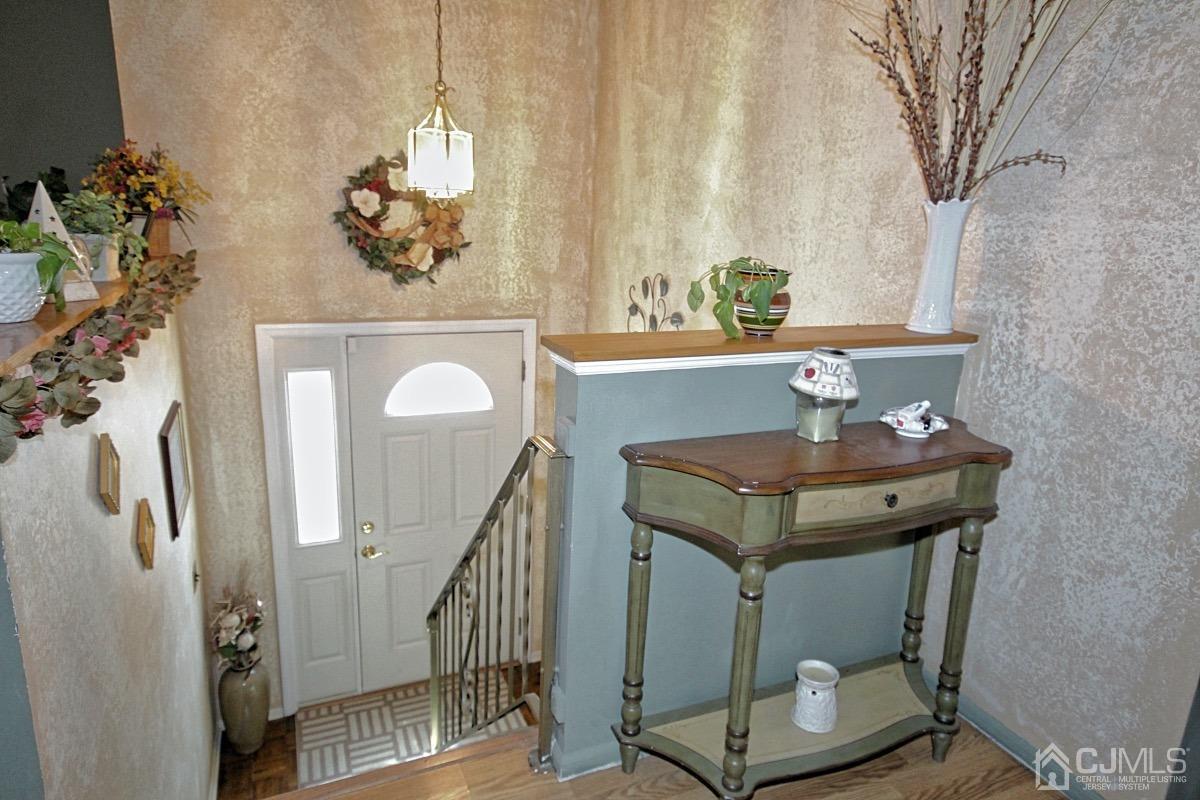 17 Higgins Road Old Bridge, NJ 08857 - Photo 3 of 30 a bath room with a table and a chandelier