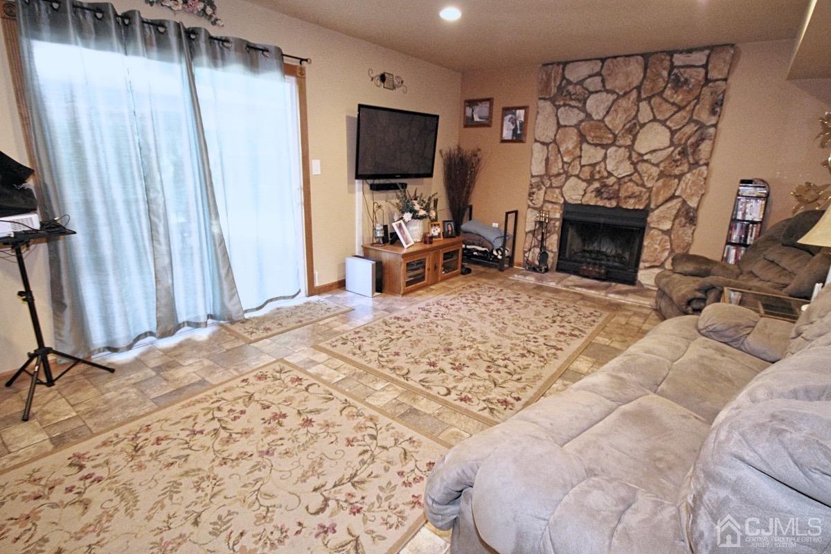 17 Higgins Road Old Bridge, NJ 08857 - Photo 24 of 30 a living room with furniture and a flat screen tv