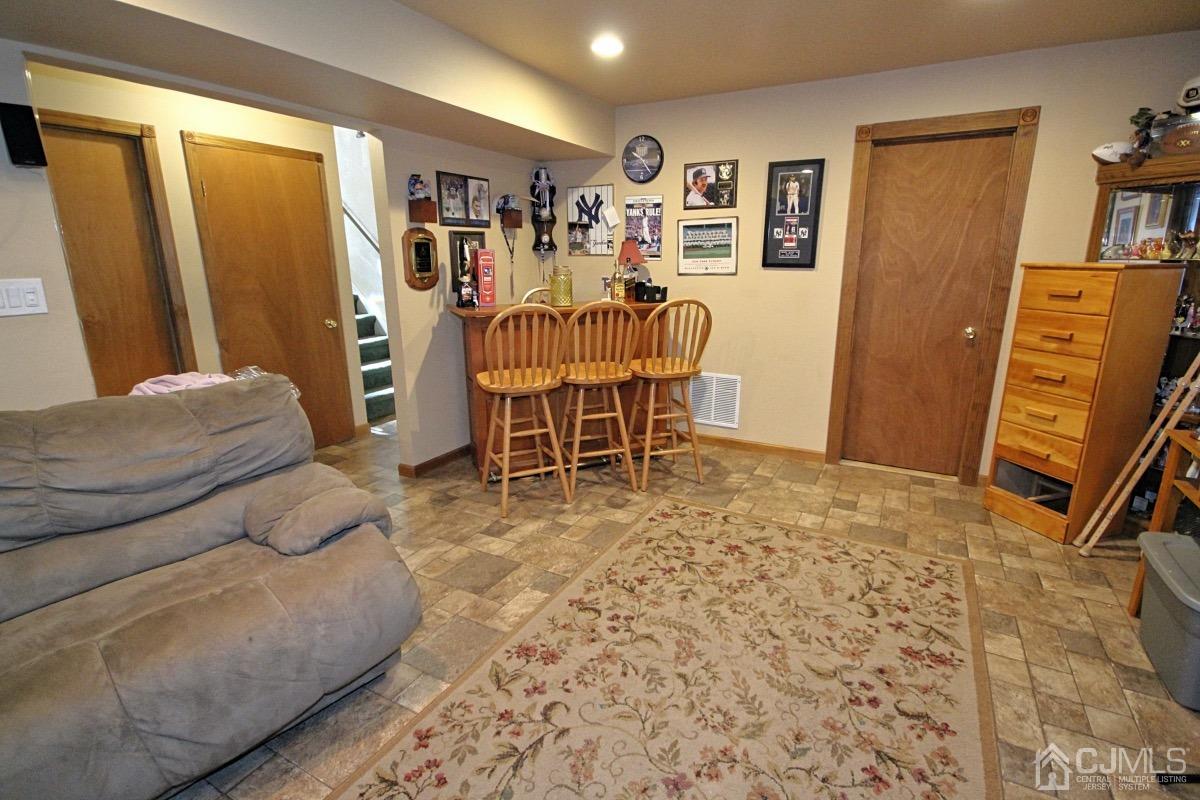 17 Higgins Road Old Bridge, NJ 08857 - Photo 25 of 30 a living room with furniture and a flat screen tv