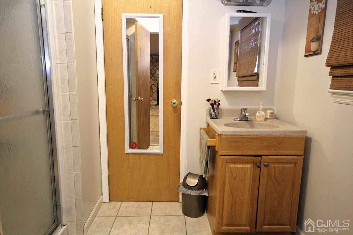 17 Higgins Road Old Bridge, NJ 08857 - Photo 26 of 30 a bathroom with a sink and a mirror