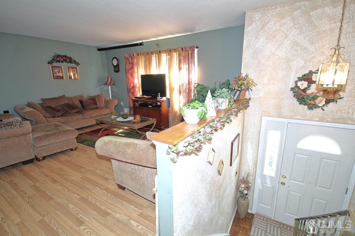 17 Higgins Road Old Bridge, NJ 08857 - Photo 4 of 30 a living room with furniture and a flat screen tv