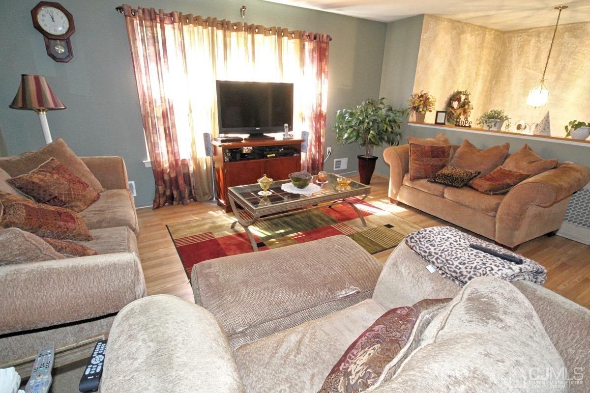 17 Higgins Road Old Bridge, NJ 08857 - Photo 7 of 30 a living room with furniture and a flat screen tv