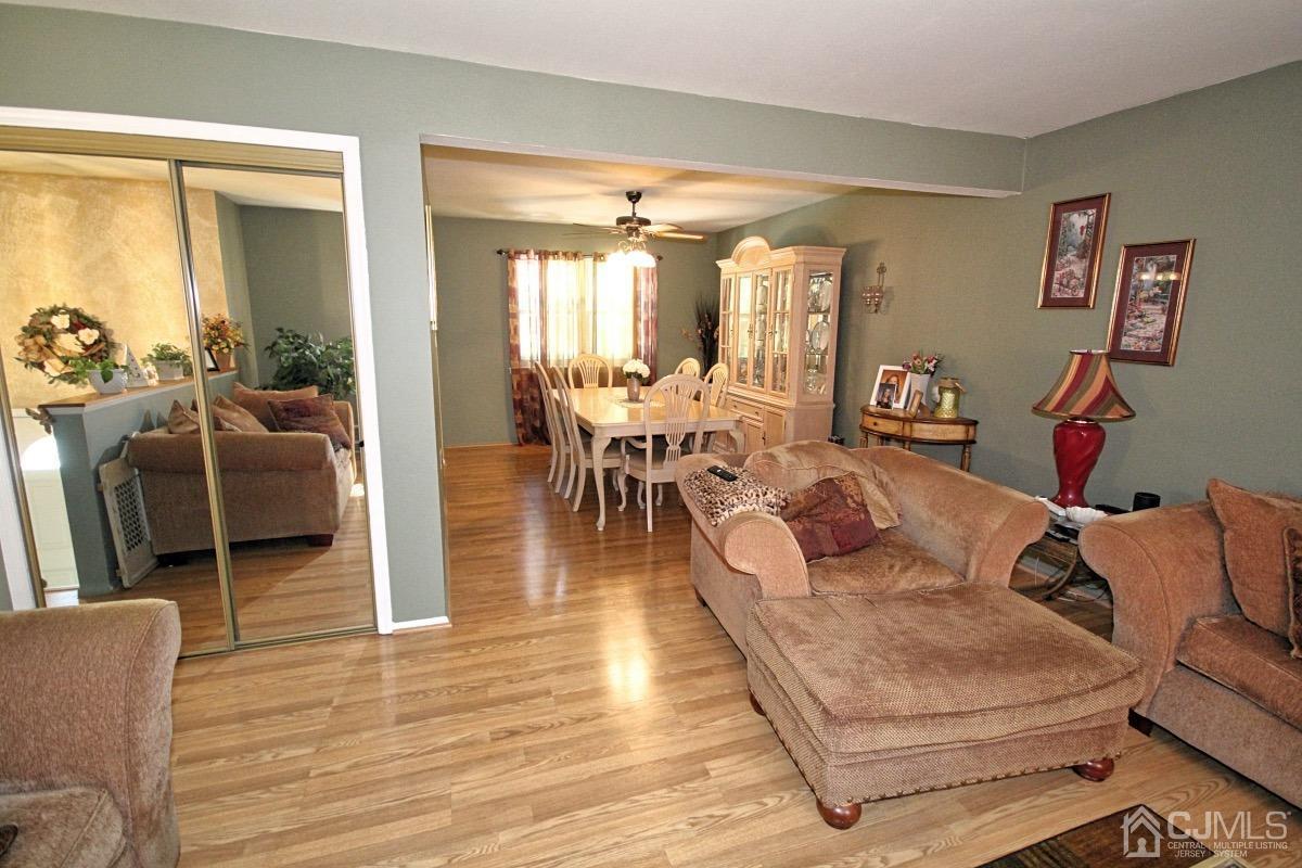 17 Higgins Road Old Bridge, NJ 08857 - Photo 8 of 30 a living room with furniture dining table and a large window