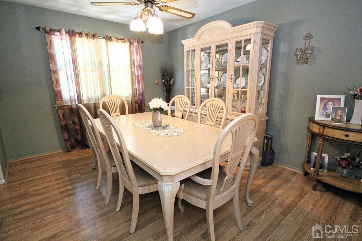 17 Higgins Road Old Bridge, NJ 08857 - Photo 9 of 30 a view of a dining room with furniture wooden floor and chandelier