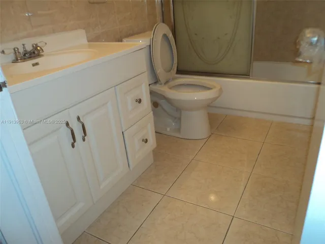 a bathroom with a toilet and a sink