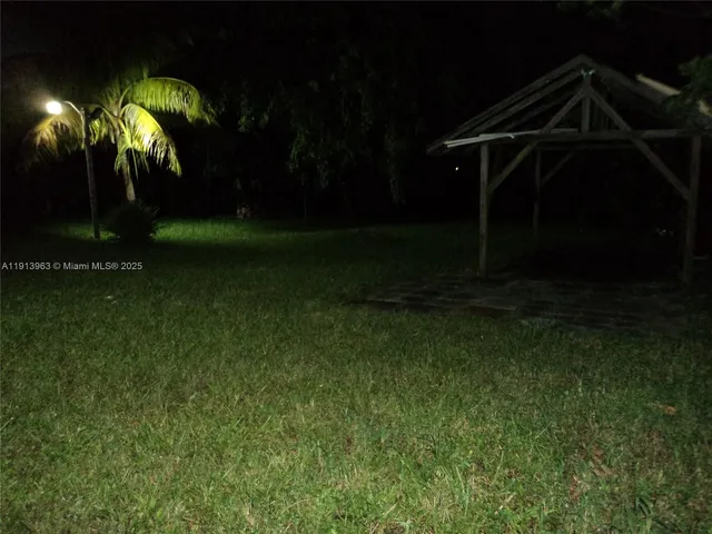 a view of a backyard of the house