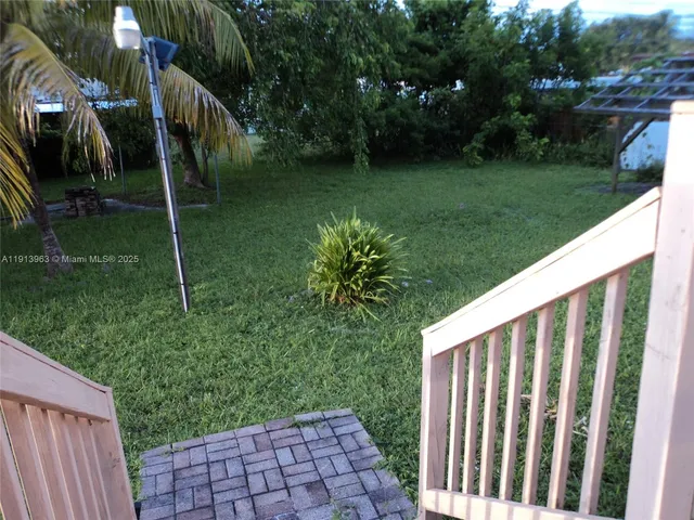 a view of backyard with green space