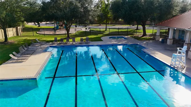 a view of a swimming pool with a patio