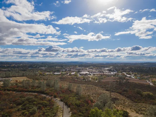 a view of house with a yard