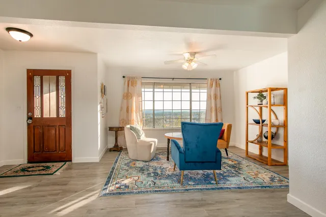 a view of a livingroom with furniture and windows