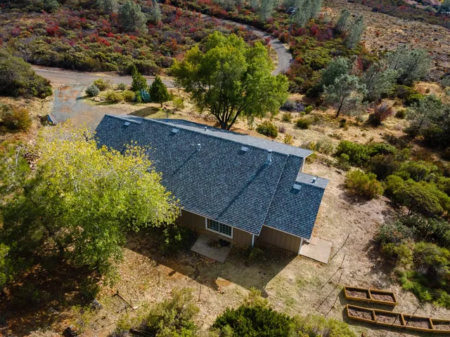 an aerial view of residential house with outdoor space