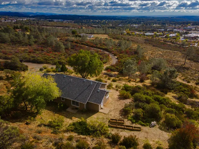 a view of house with a yard