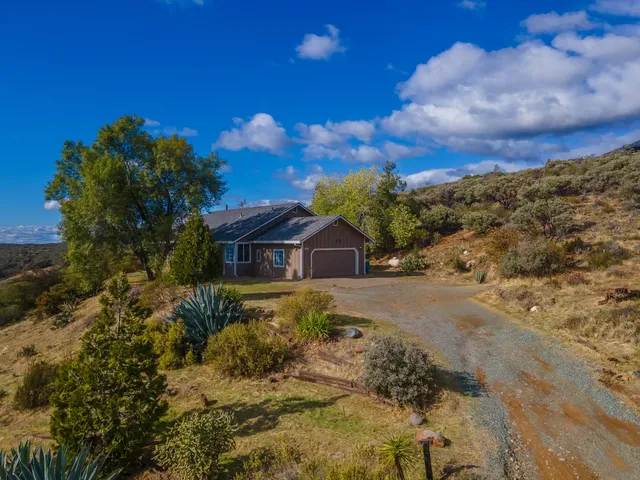 a close up of a dining table with chairs