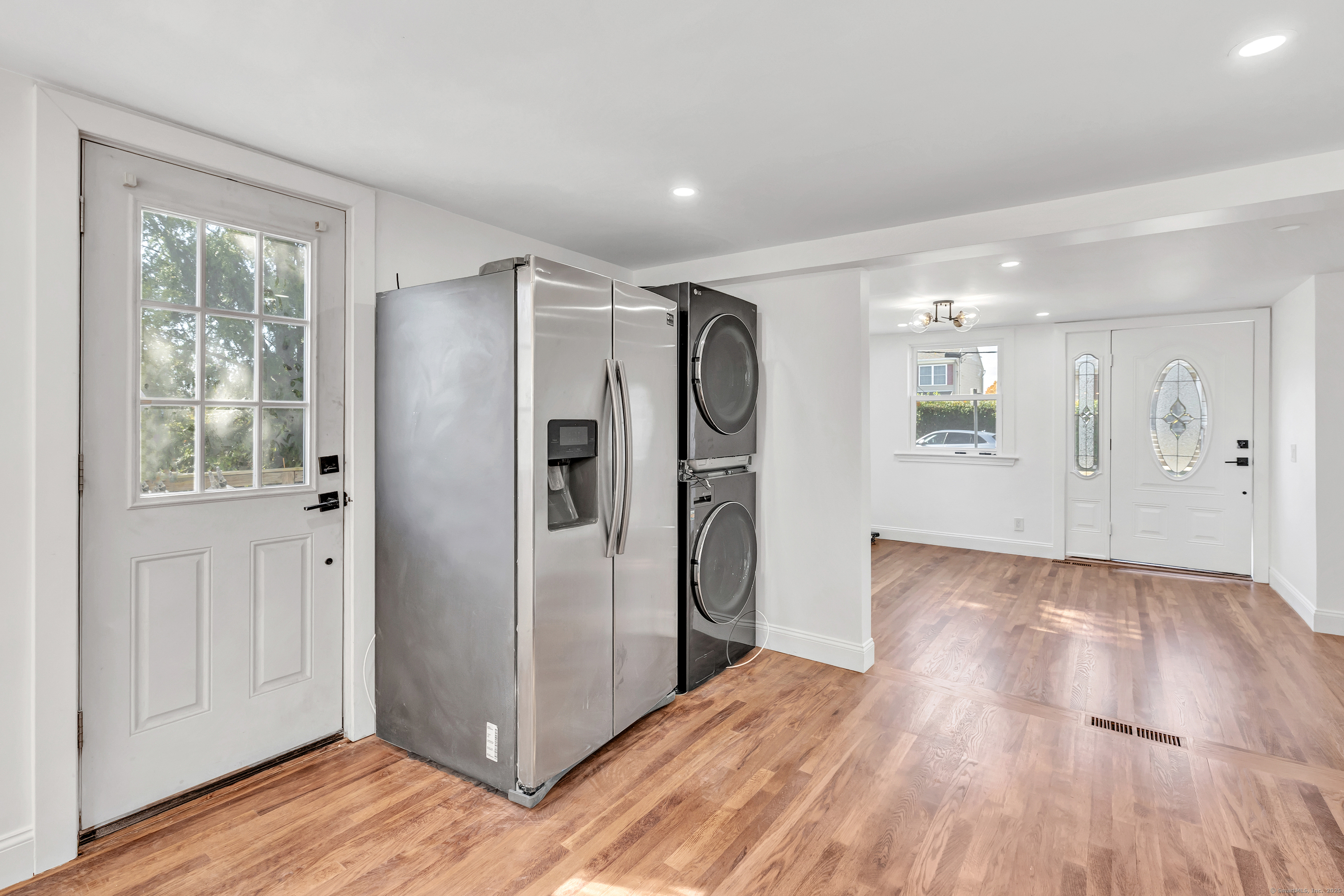 14 Fairview Avenue, Unit B Norwalk, CT 06850 - Photo 13 of 31 a view of a refrigerator in kitchen and wooden floor