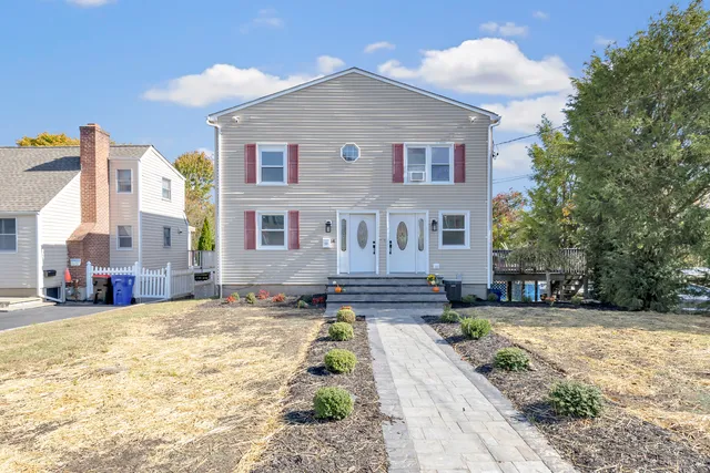 a view of a house with a yard